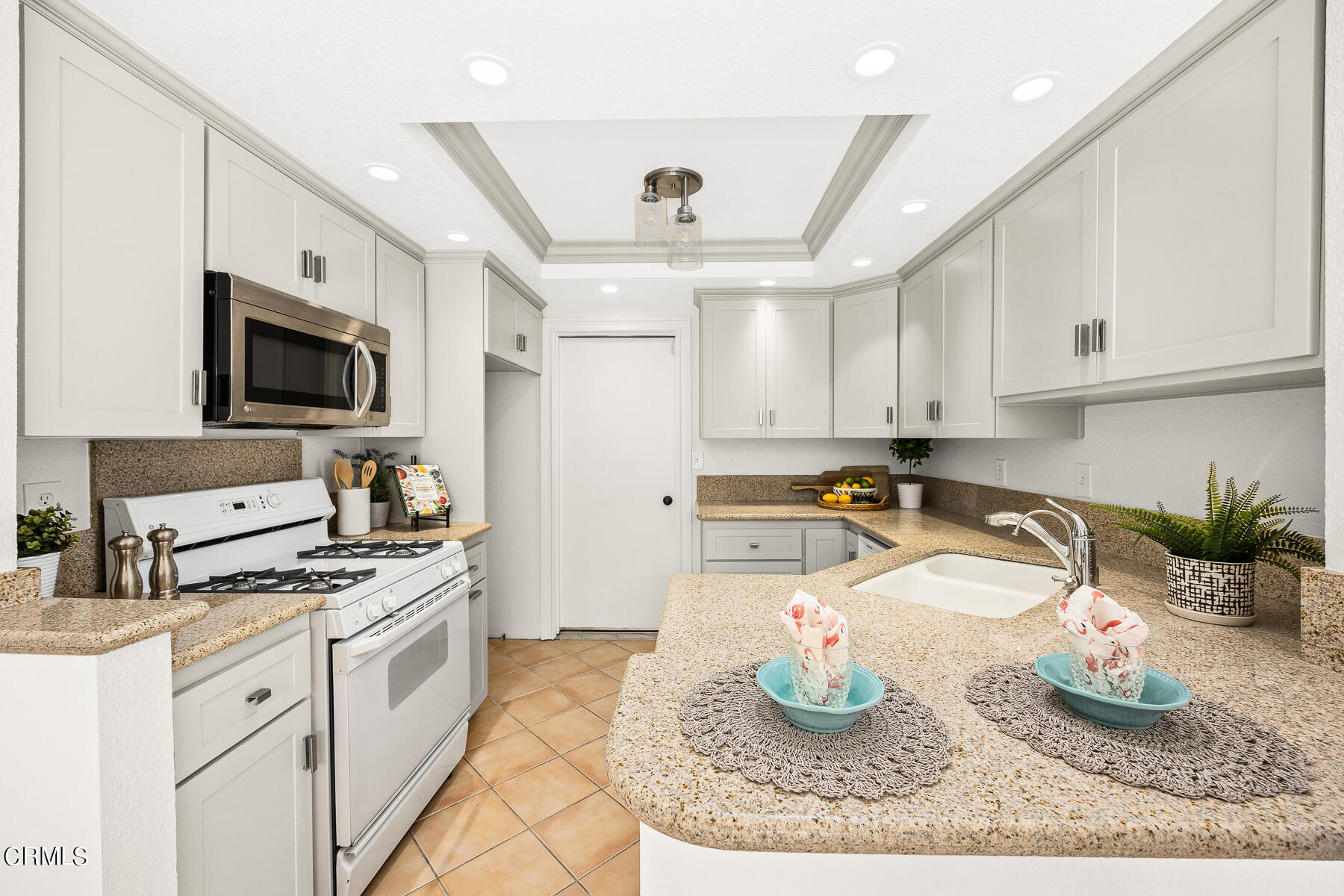 2624 Doray Circle Monrovia, CA 91016 - Photo 13 of 33 a kitchen with granite countertop a sink stove and cabinets