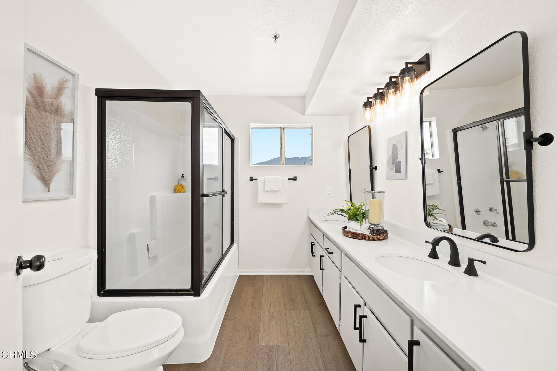 2624 Doray Circle Monrovia, CA 91016 - Photo 20 of 33 a bathroom with a double vanity sink toilet mirror and shower