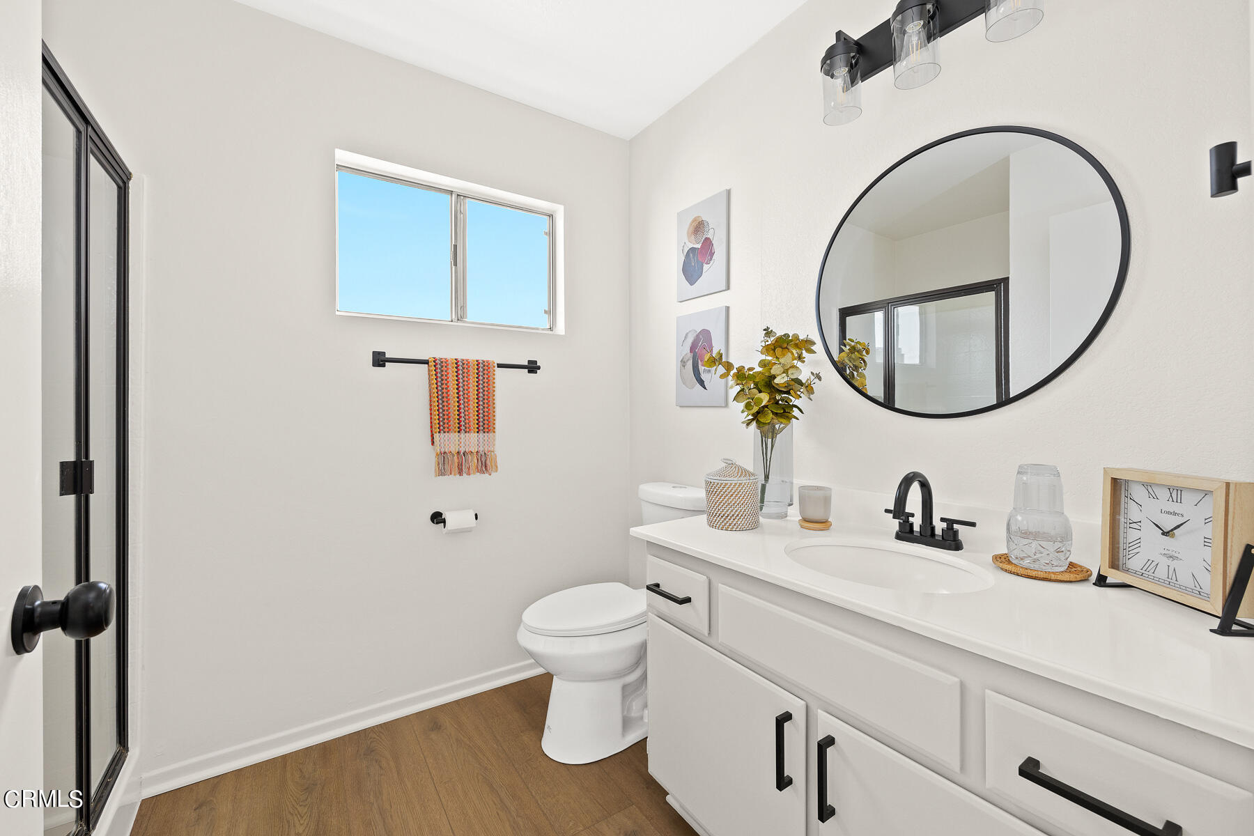 2624 Doray Circle Monrovia, CA 91016 - Photo 22 of 33 a bathroom with a toilet a sink a mirror and a toilet