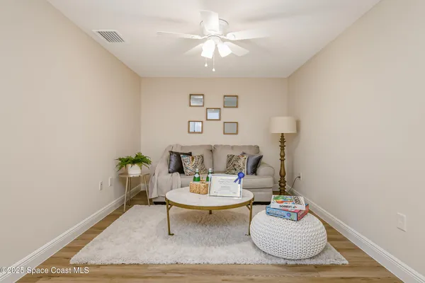 a living room with furniture and a table