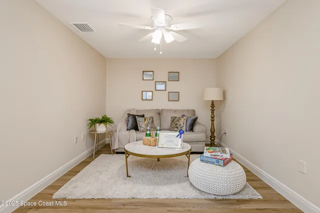 a living room with furniture and a table