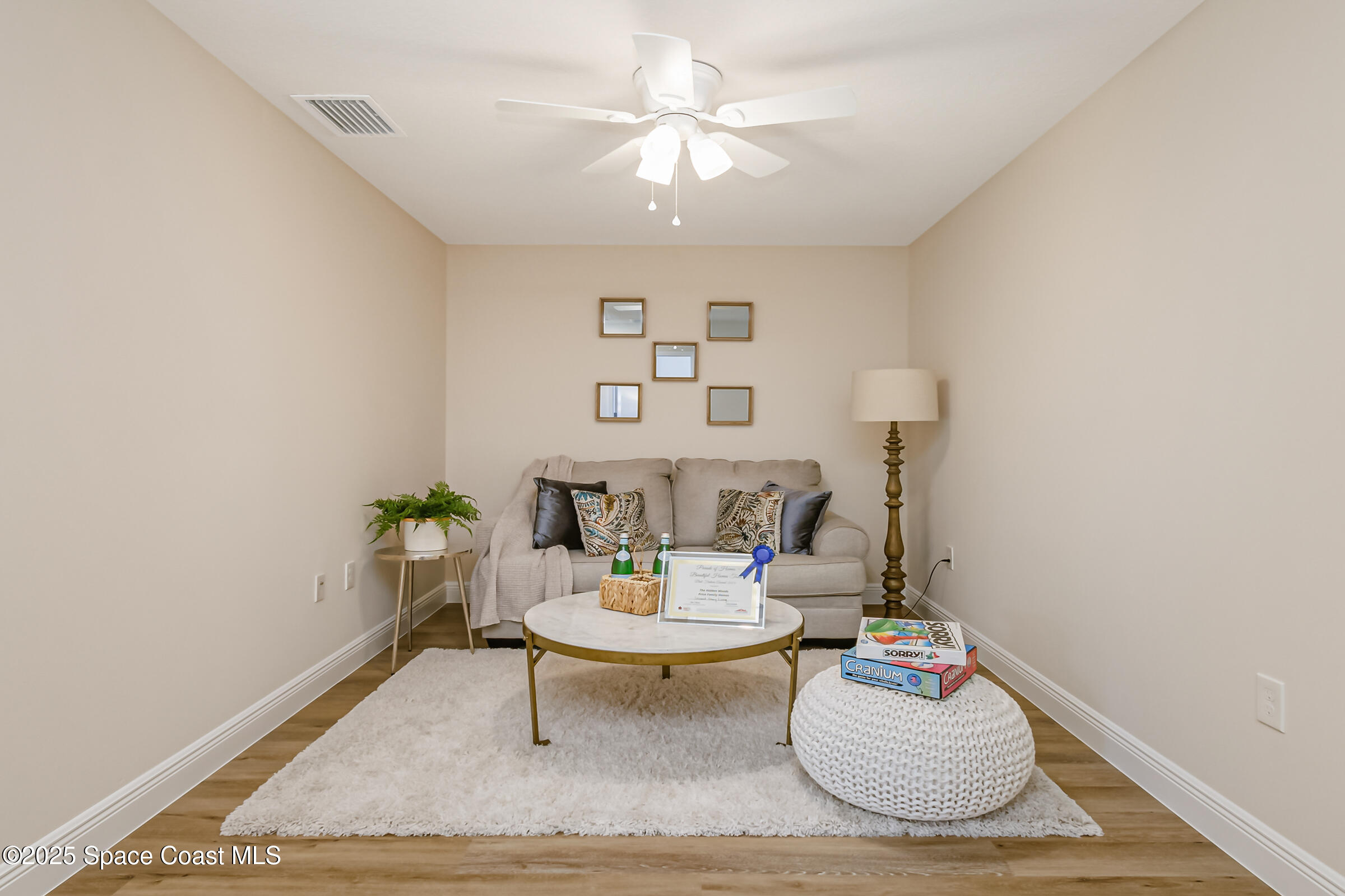 187 Hidden Woods Place Melbourne, FL 32901 - Photo 20 of 40 a living room with furniture and a table