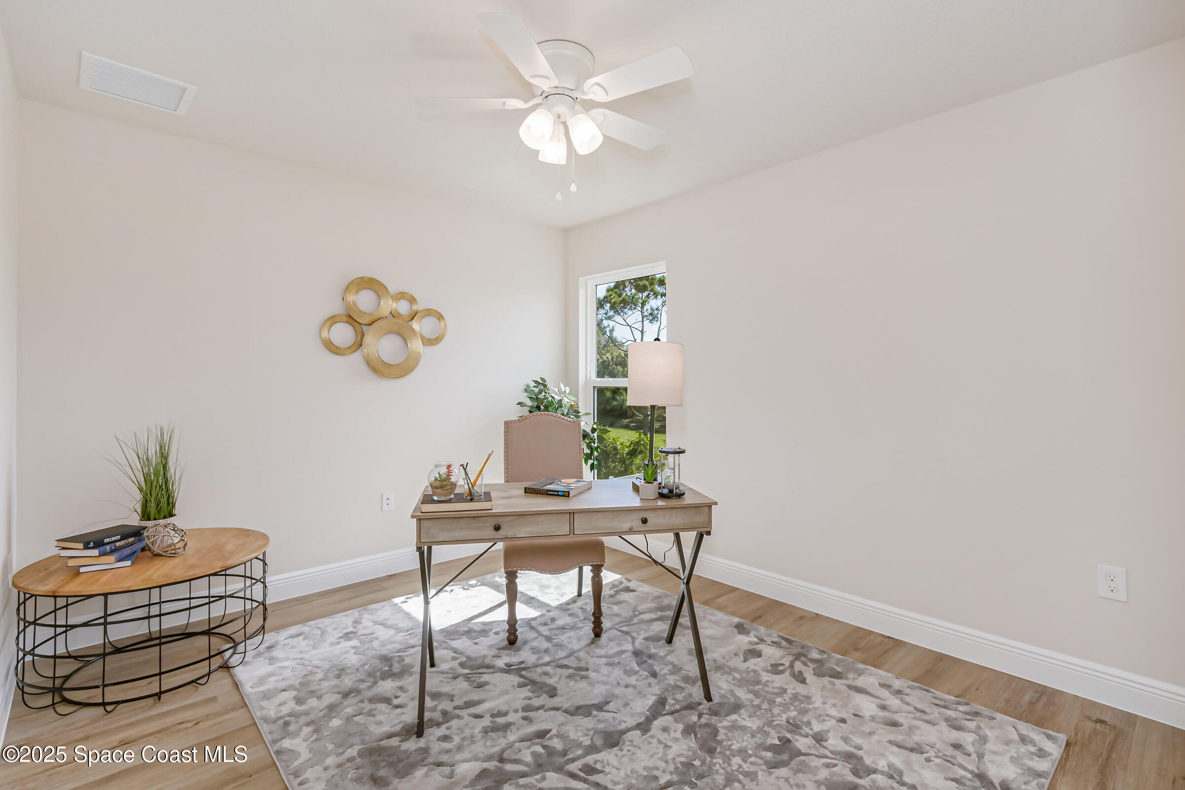 187 Hidden Woods Place Melbourne, FL 32901 - Photo 23 of 40 a living room with furniture and a table