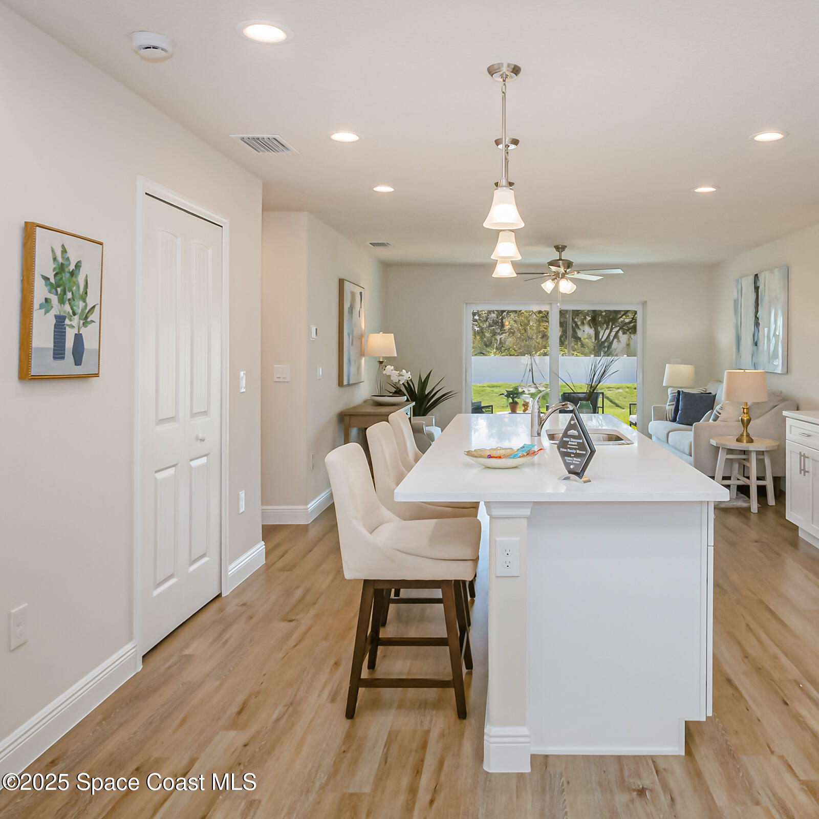 187 Hidden Woods Place Melbourne, FL 32901 - Photo 28 of 40 a view of a dining room with furniture window and wooden floor