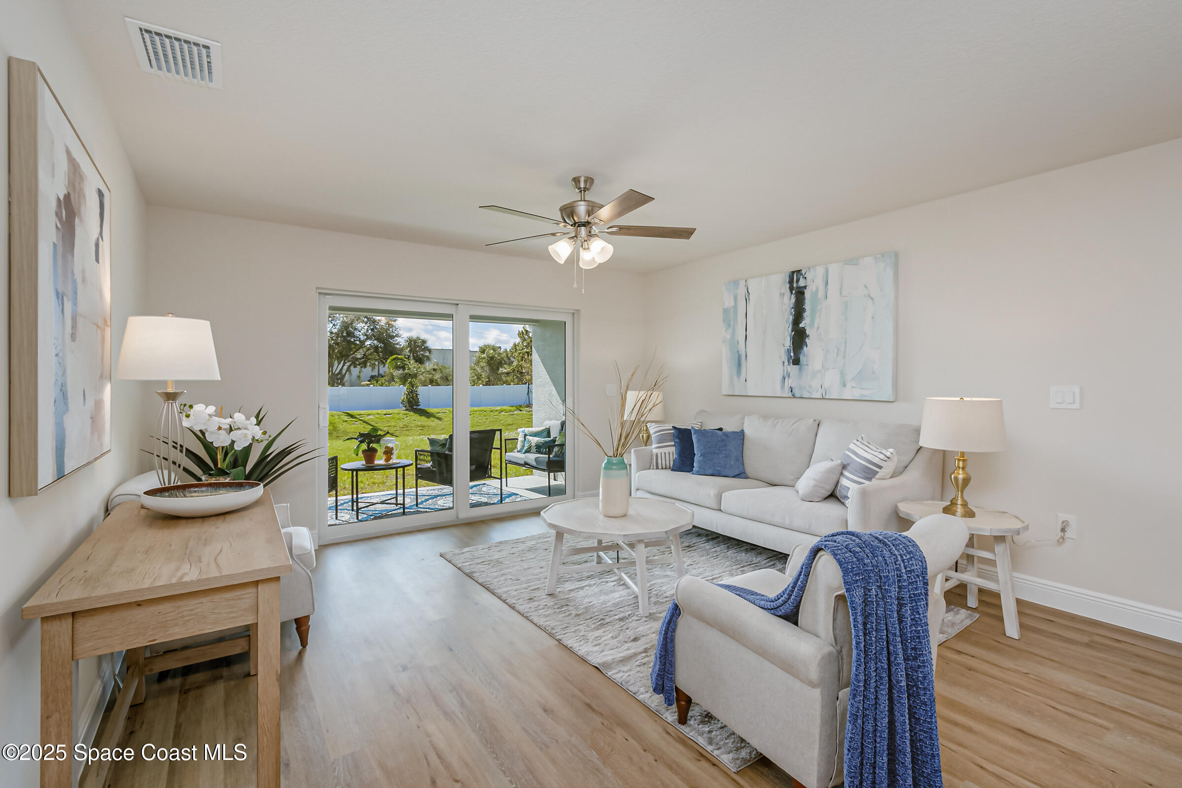 187 Hidden Woods Place Melbourne, FL 32901 - Photo 3 of 40 a living room with furniture and a fireplace
