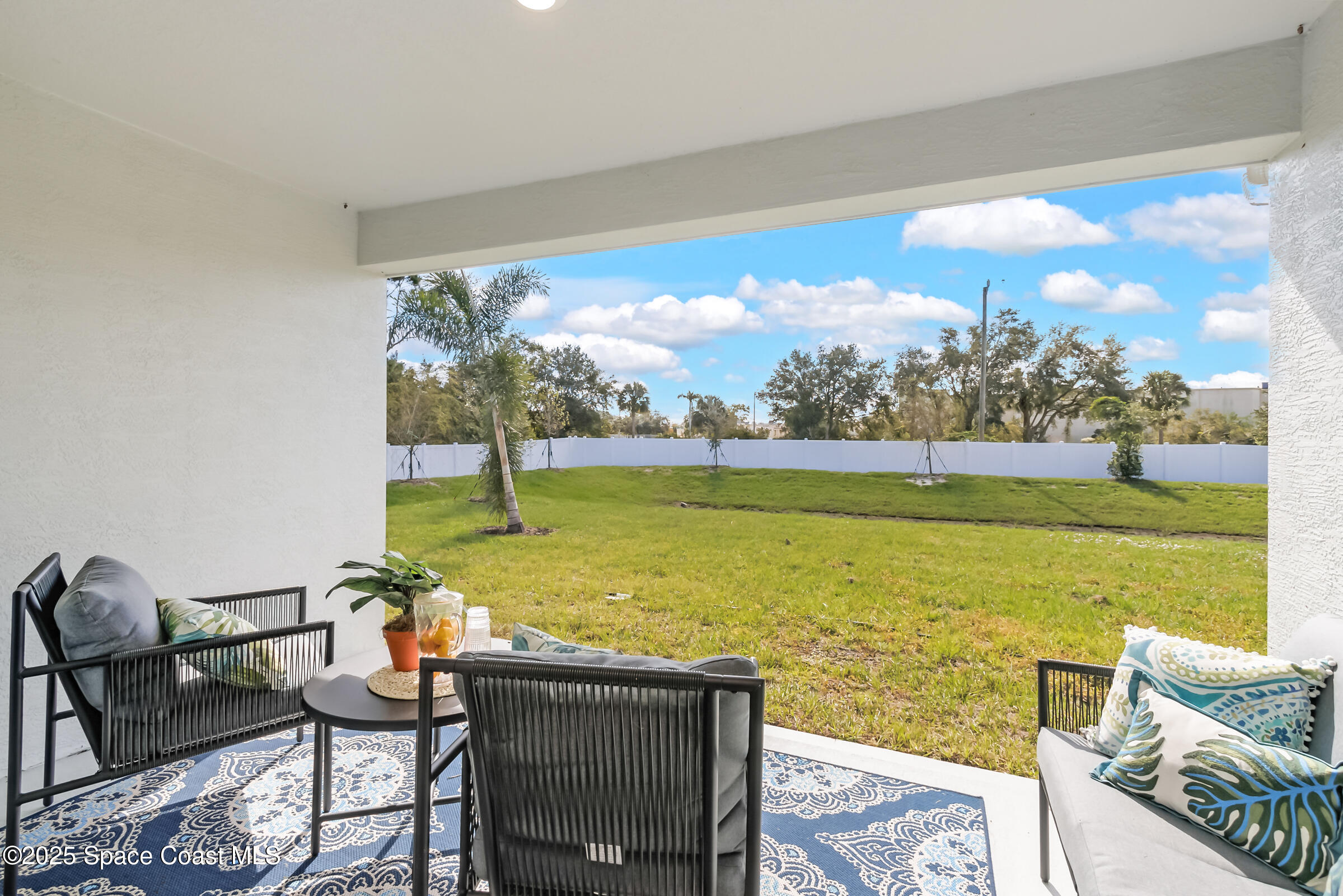 187 Hidden Woods Place Melbourne, FL 32901 - Photo 35 of 40 a view of swimming pool with lawn chairs and a yard
