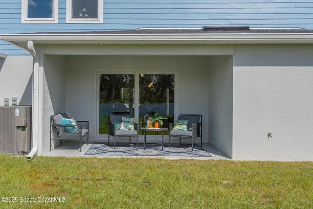 a view of swimming pool with outdoor seating