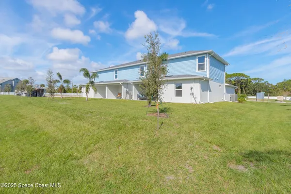 a view of a house with a big yard