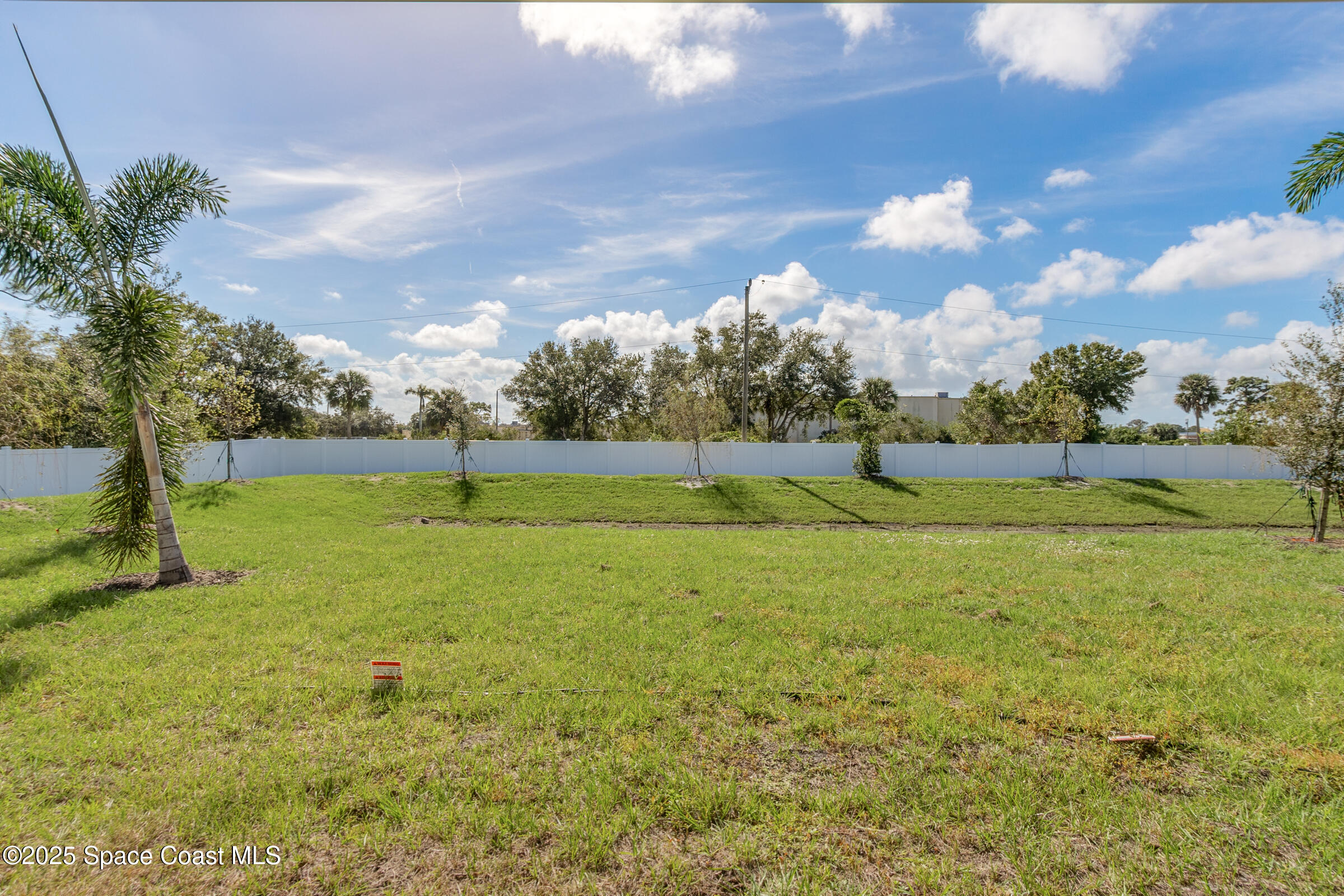 187 Hidden Woods Place Melbourne, FL 32901 - Photo 38 of 40 a view of a green field