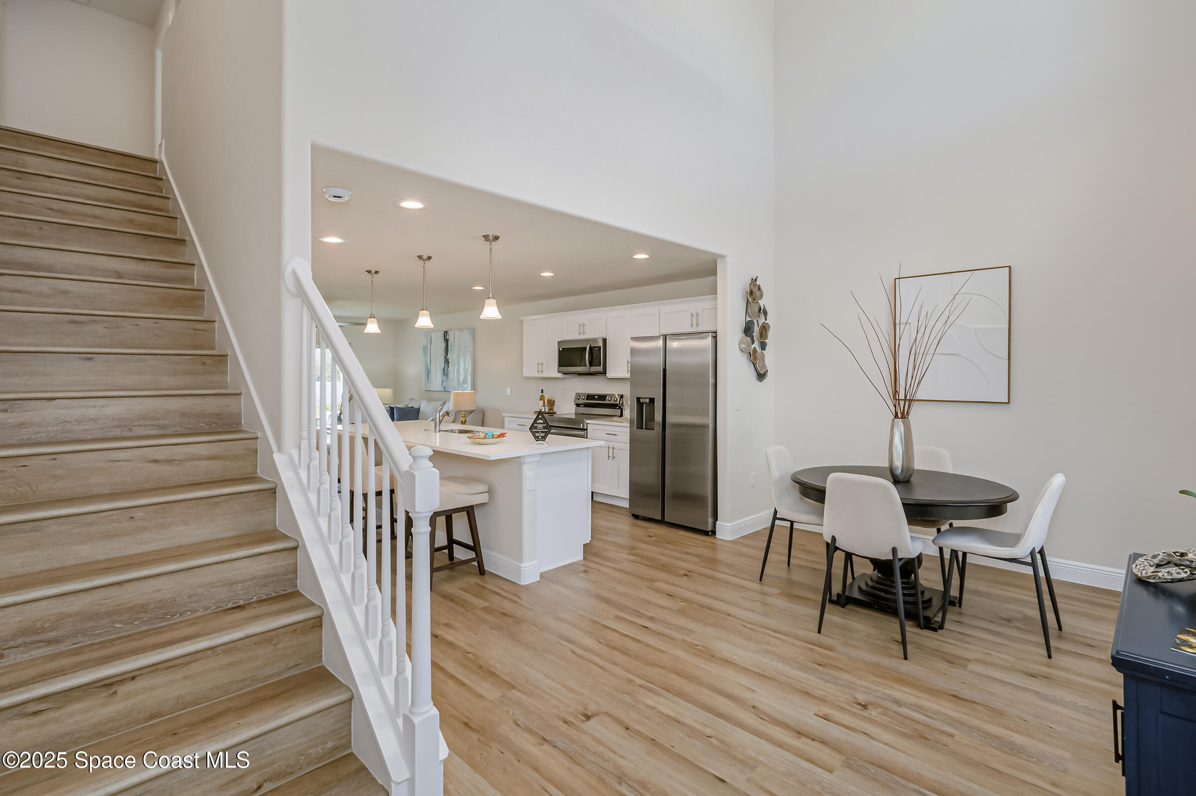 187 Hidden Woods Place Melbourne, FL 32901 - Photo 10 of 40 a living room with furniture and a wooden floor