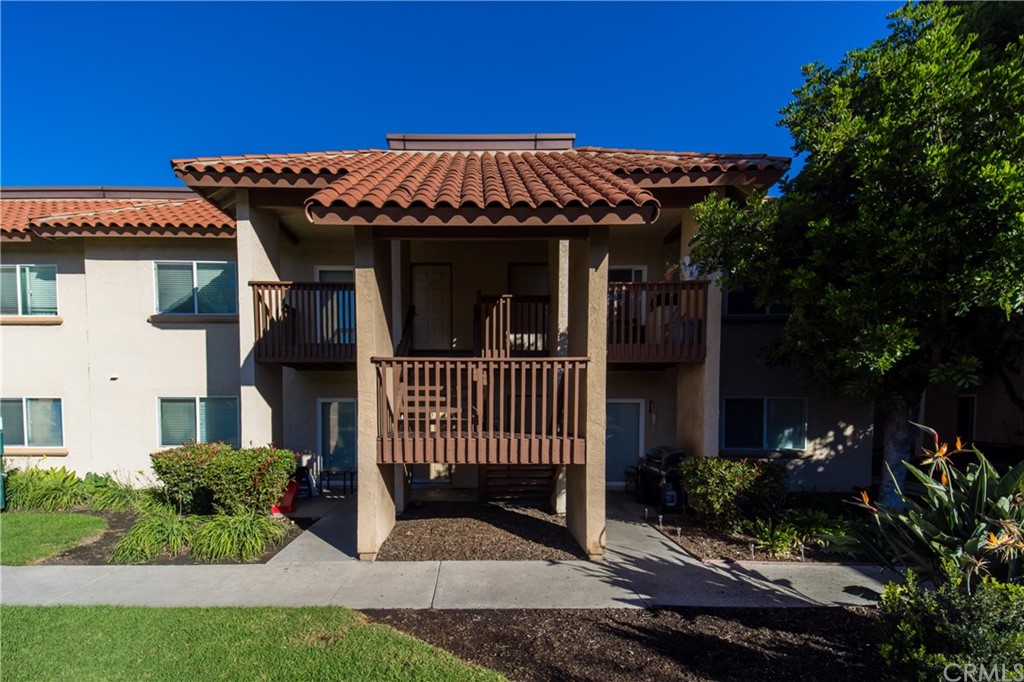 180 Chambers Street, Unit 28 El Cajon, CA 92020 - Photo 2 of 22 a view of a house with a yard and furniture