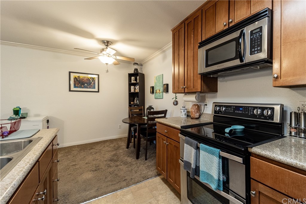 180 Chambers Street, Unit 28 El Cajon, CA 92020 - Photo 11 of 22 a kitchen with a stove cabinets and microwave