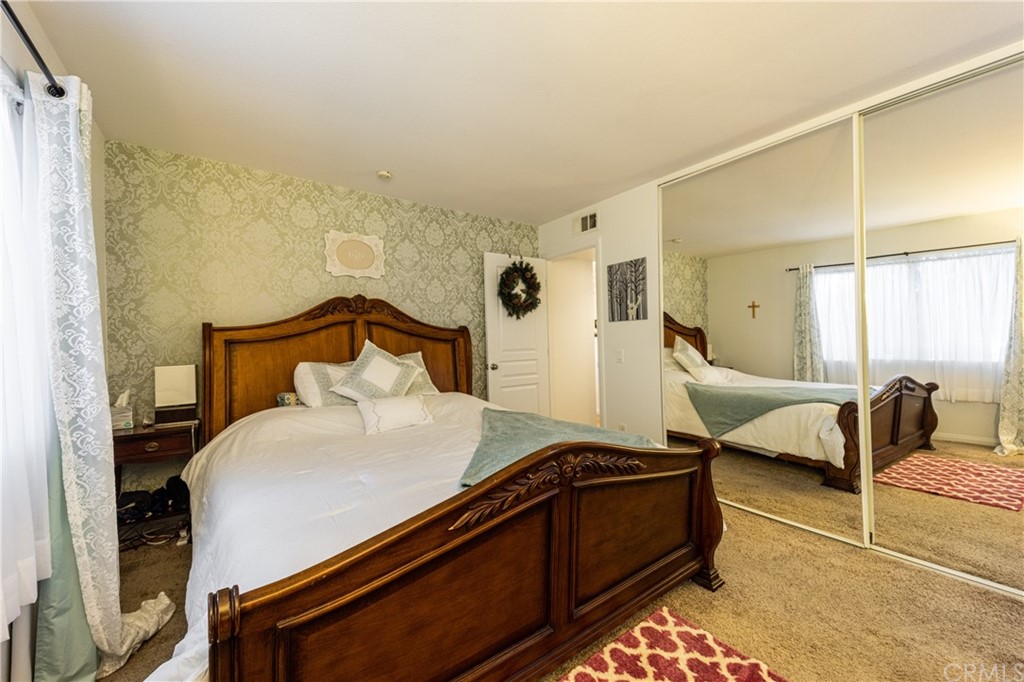 180 Chambers Street, Unit 28 El Cajon, CA 92020 - Photo 17 of 22 a bedroom with a bed and window