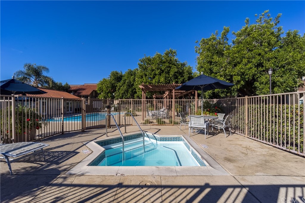 180 Chambers Street, Unit 28 El Cajon, CA 92020 - Photo 20 of 22 a view of backyard with outdoor seating and wooden fence