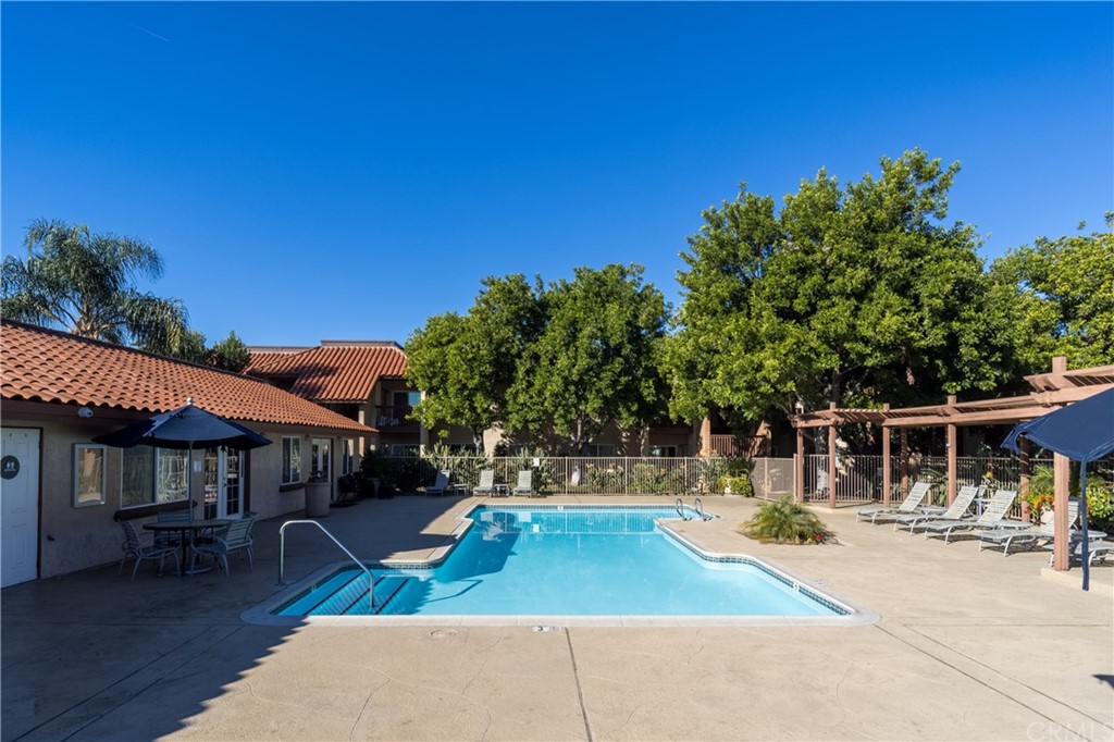 180 Chambers Street, Unit 28 El Cajon, CA 92020 - Photo 21 of 22 a view of a house with swimming pool and sitting area