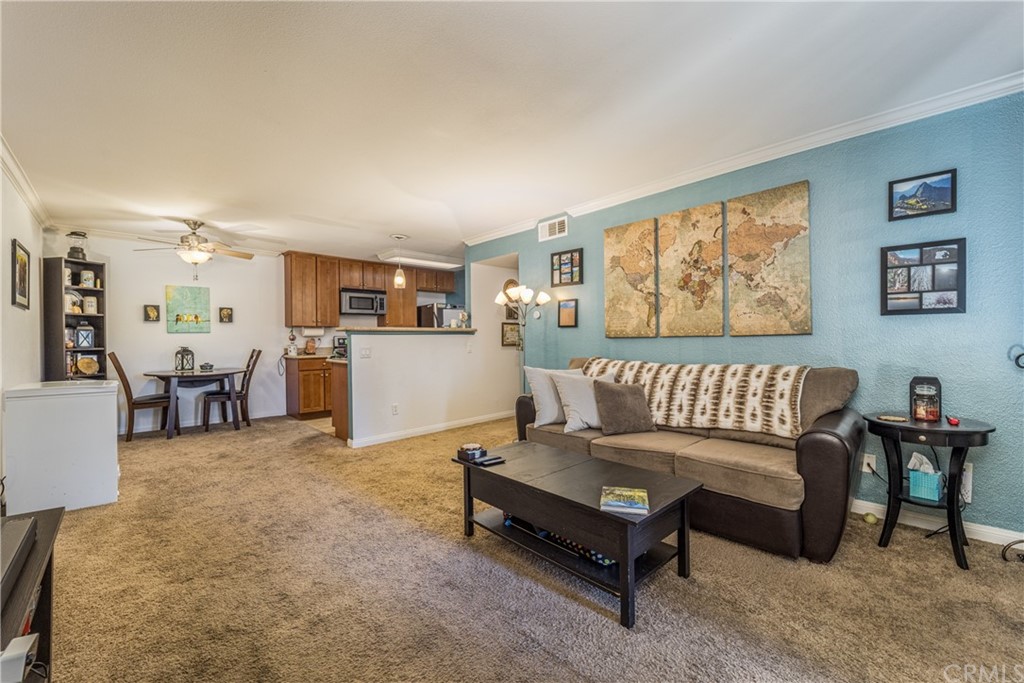 180 Chambers Street, Unit 28 El Cajon, CA 92020 - Photo 4 of 22 a living room with furniture and a table