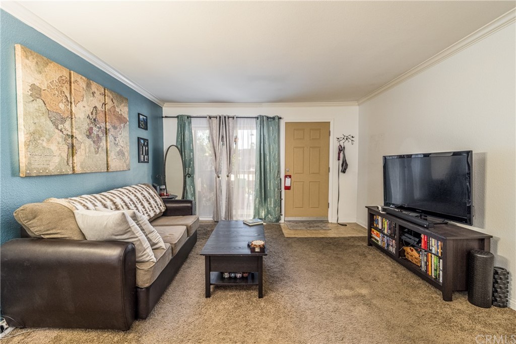 180 Chambers Street, Unit 28 El Cajon, CA 92020 - Photo 5 of 22 a living room with furniture and a flat screen tv