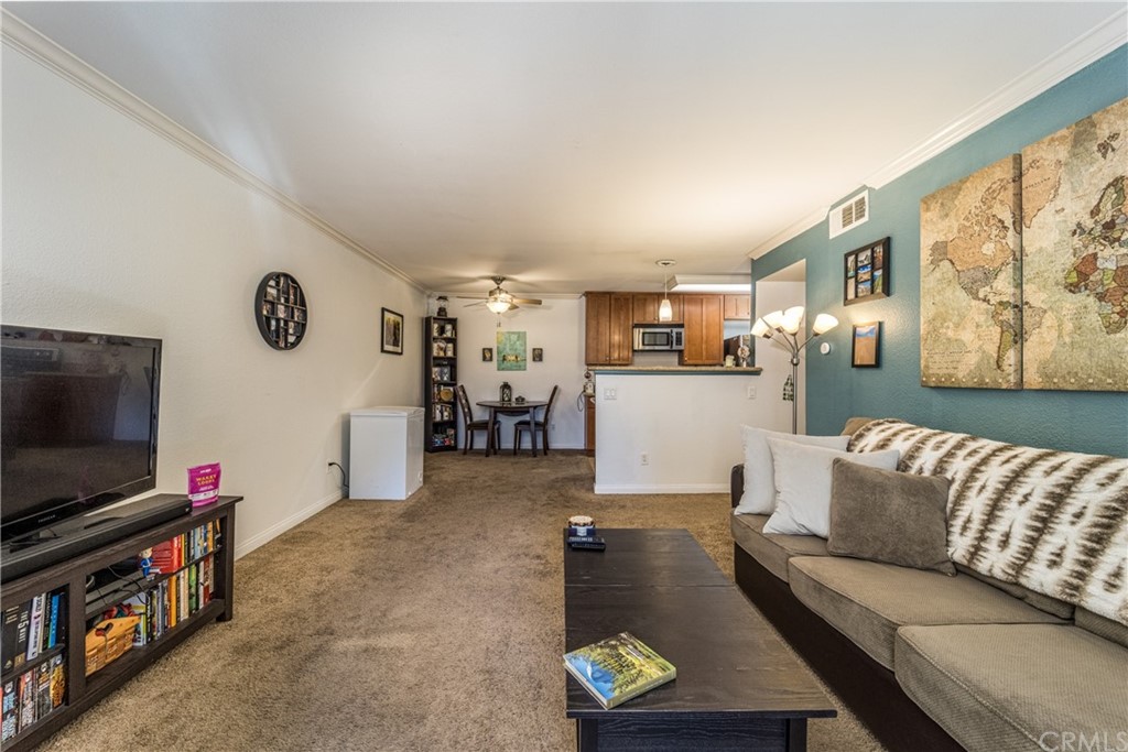 180 Chambers Street, Unit 28 El Cajon, CA 92020 - Photo 6 of 22 a living room with furniture and a flat screen tv