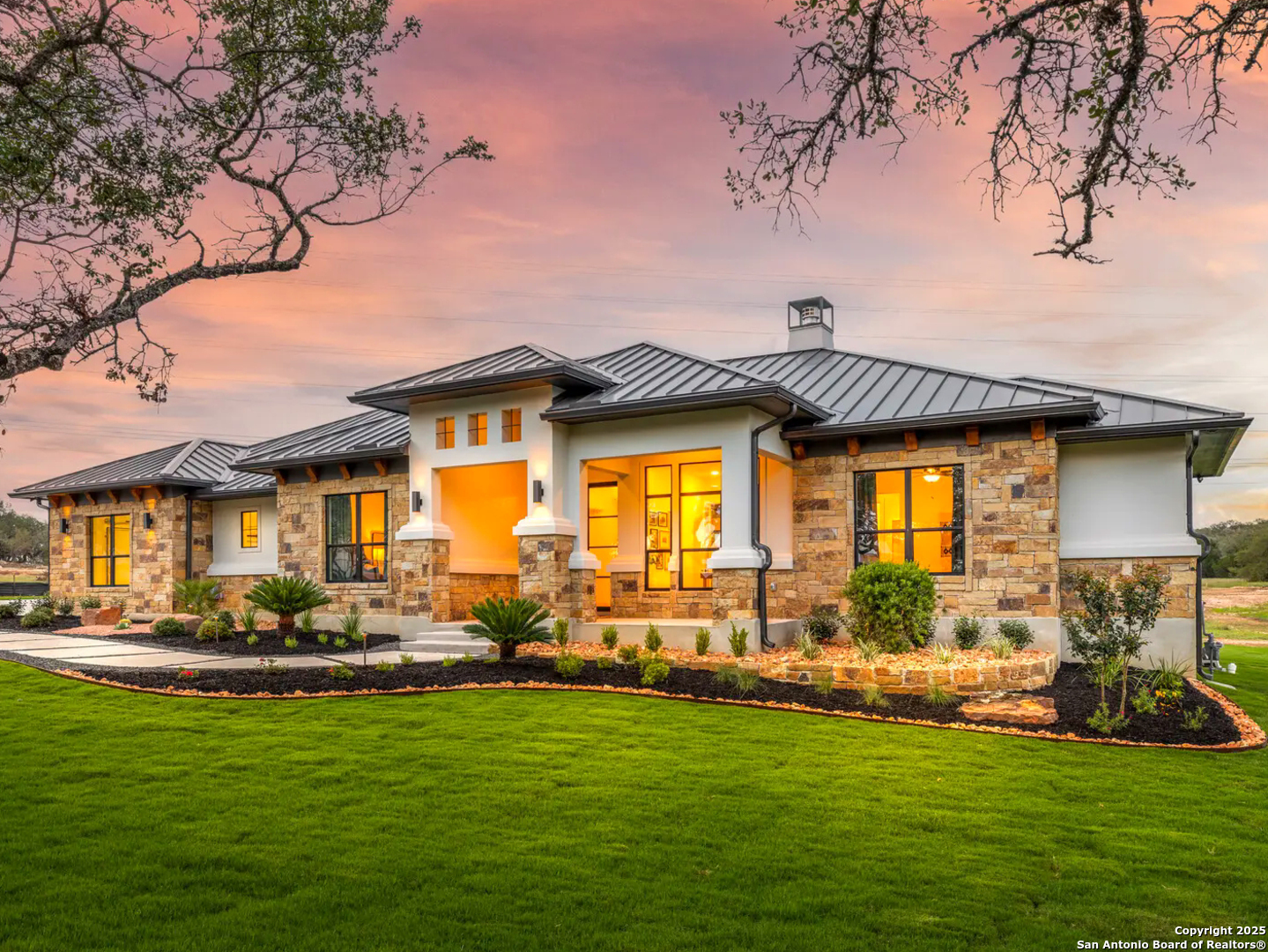 1217 Rio Central Drive Spring Branch, TX 78070 - Photo 2 of 7 a front view of a house with a garden