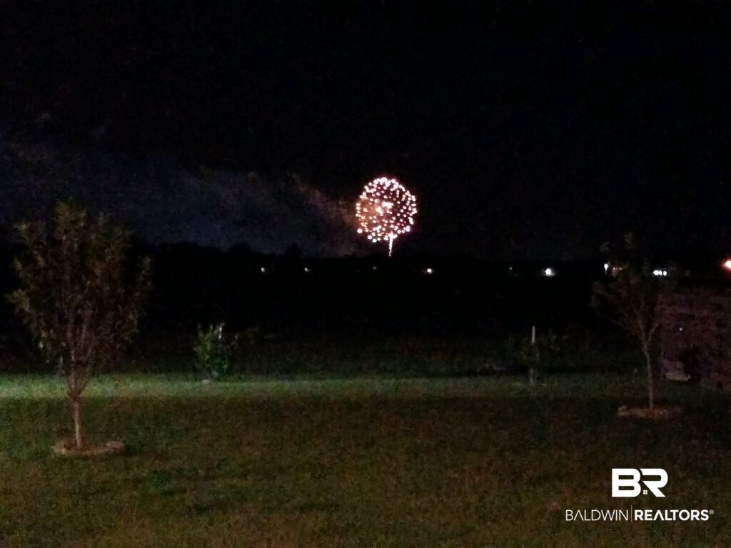 7065 Rocky Rd Loop Gulf Shores, AL 36542 - Photo 47 of 47 OWA FIREWORKS FROM THE BACKYARD