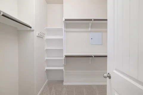 a view of an empty walk in closet