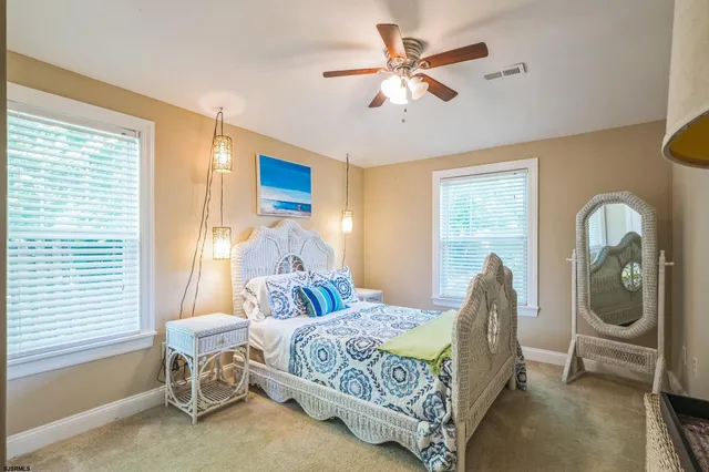 a living room with a bed furniture and a window