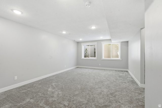 338 Windy Rdg Drive Smithfield, UT 84335 - Photo 40 of 63 Spacious room featuring neutral gray walls, gray carpeting, and recessed lighting