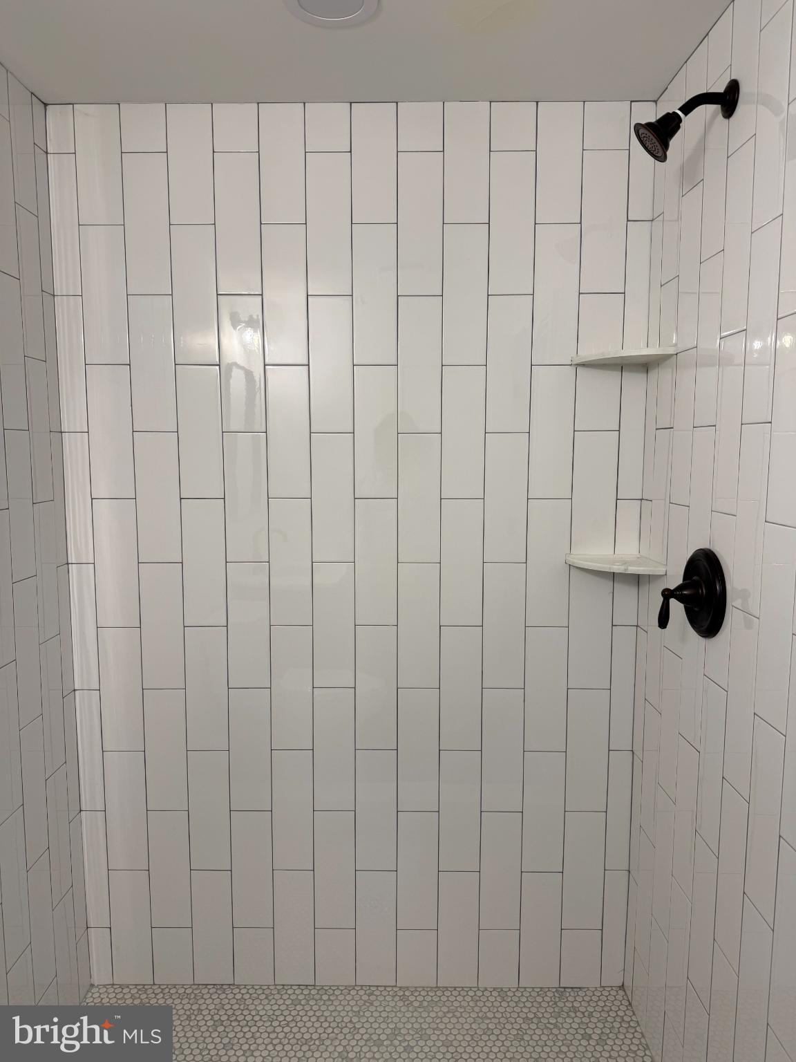 3923 Roland Avenue Baltimore, MD 21211 - Photo 8 of 13 a bathroom with a shower