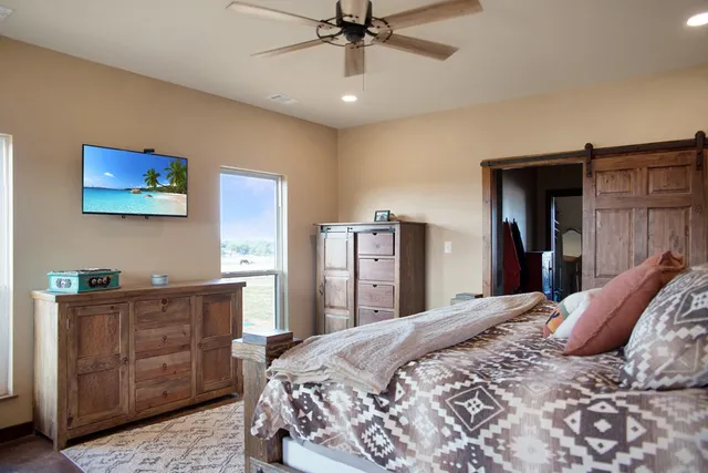a bedroom with a bed and a dresser
