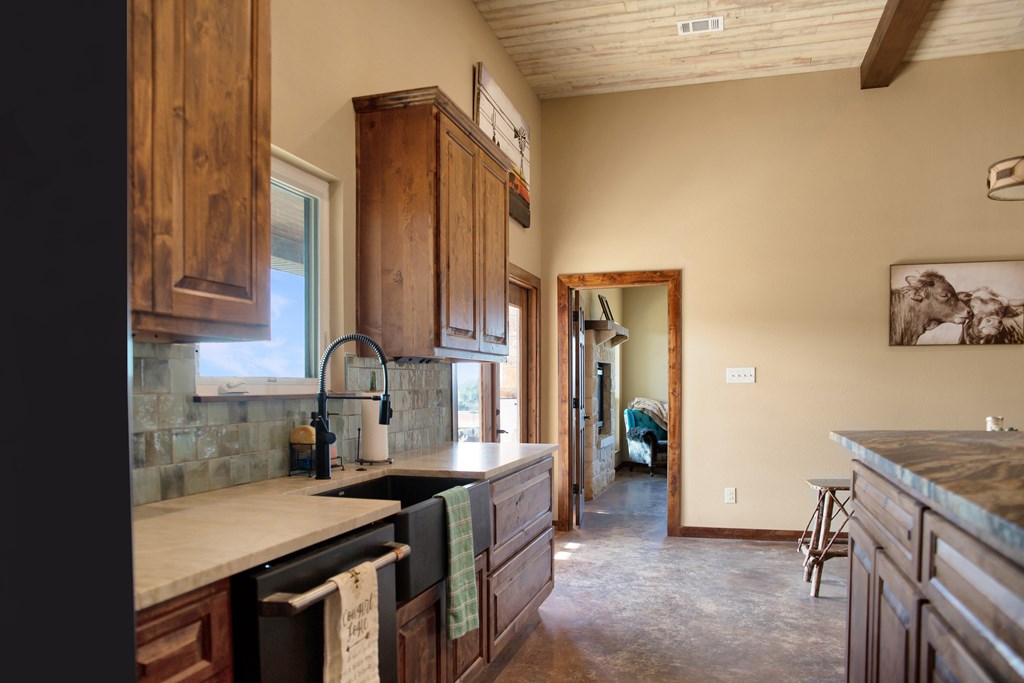 4252 Cypress Mill Road Johnson City, TX 78636 - Photo 13 of 47 a view of a kitchen with cabinets