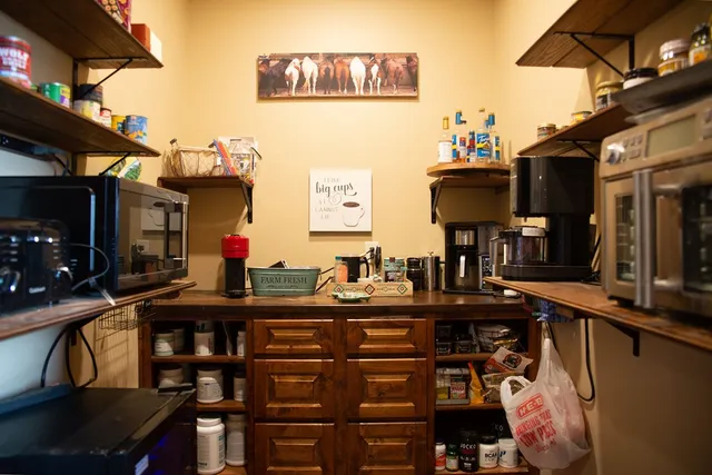 a view of a dining room with furniture and a potted plant