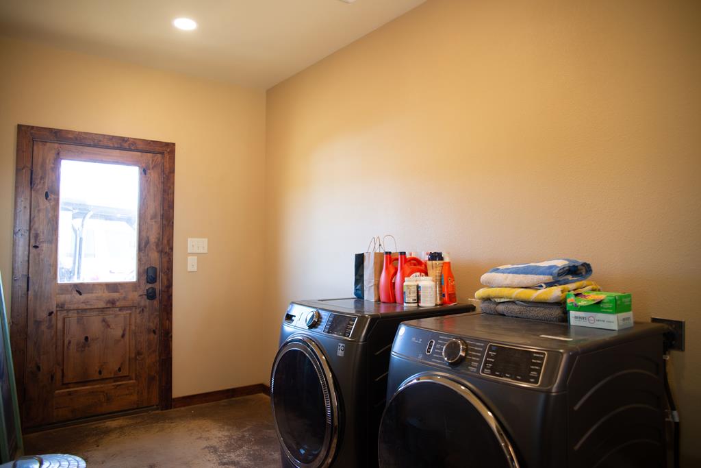 4252 Cypress Mill Road Johnson City, TX 78636 - Photo 19 of 47 a utility room with dryer and washer