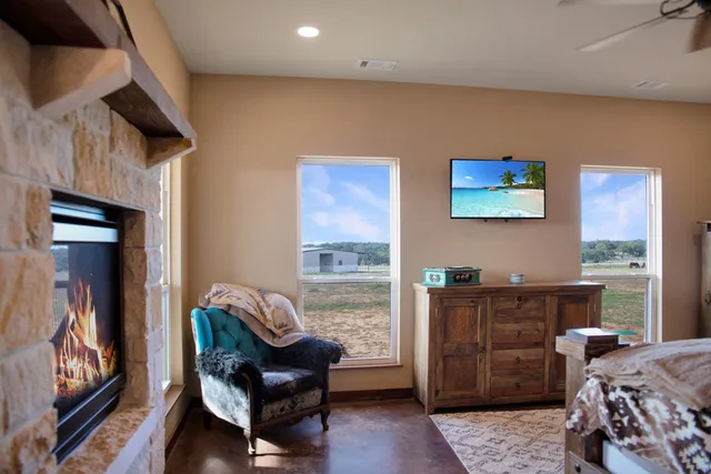 a bedroom with furniture and a window