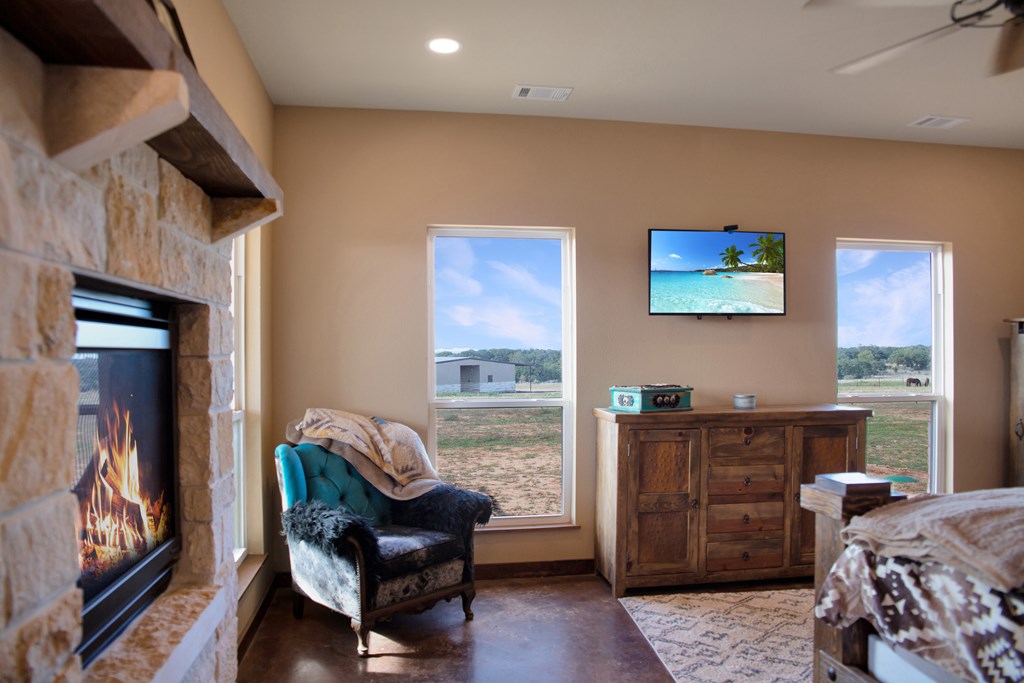 4252 Cypress Mill Road Johnson City, TX 78636 - Photo 10 of 47 a bedroom with furniture and a window