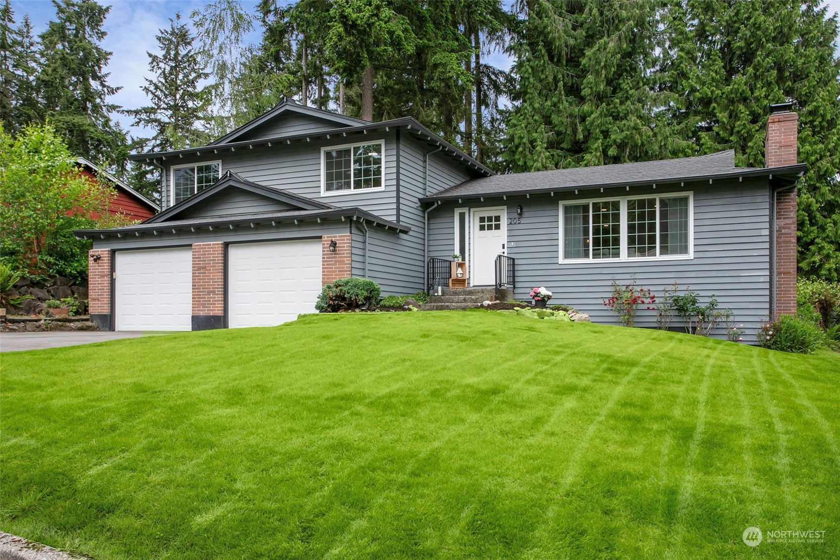 a front view of house with yard and green space
