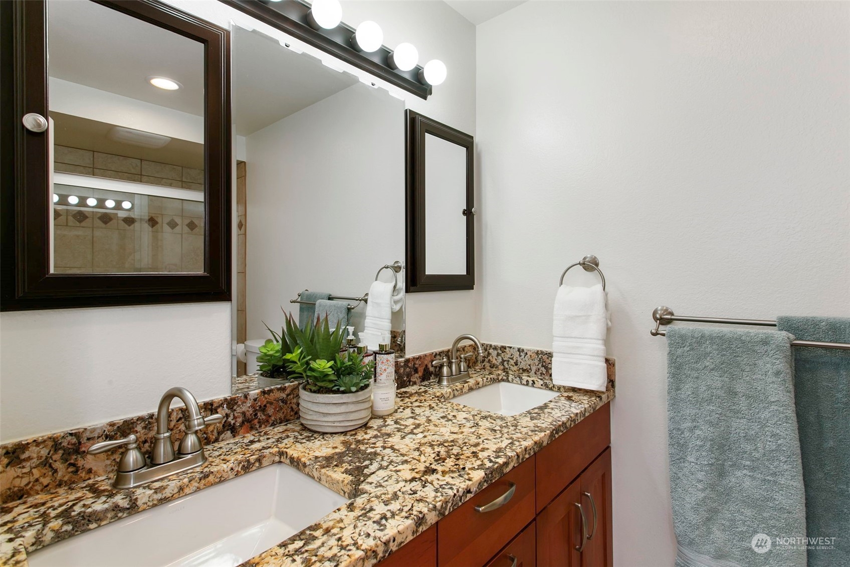 205 155th Place Southeast Bothell, WA 98012 - Photo 15 of 37 a bathroom with a sink and a mirror