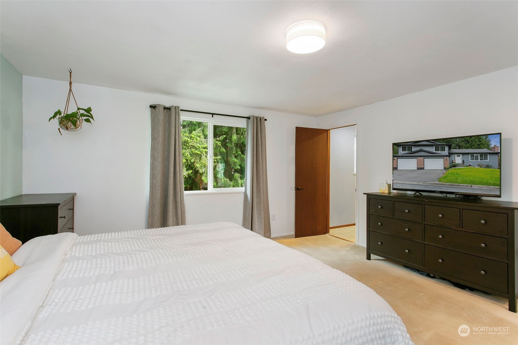 205 155th Place Southeast Bothell, WA 98012 - Photo 16 of 37 a bedroom with a bed and a dresser
