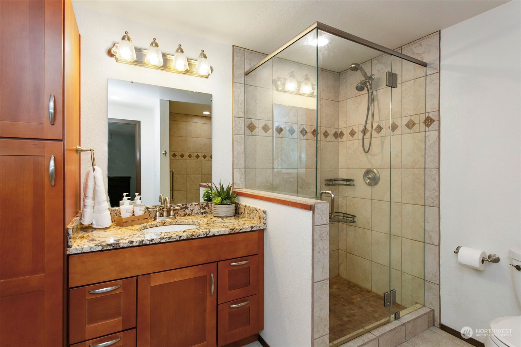 205 155th Place Southeast Bothell, WA 98012 - Photo 17 of 37 a bathroom with a shower sink vanity and mirror