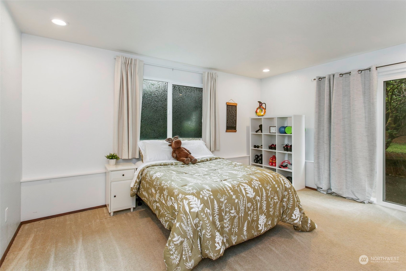 205 155th Place Southeast Bothell, WA 98012 - Photo 19 of 37 a bedroom with a large bed and a large window