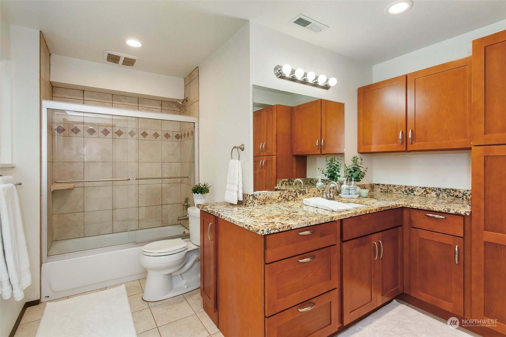 205 155th Place Southeast Bothell, WA 98012 - Photo 21 of 37 a bathroom with a granite countertop sink toilet and shower
