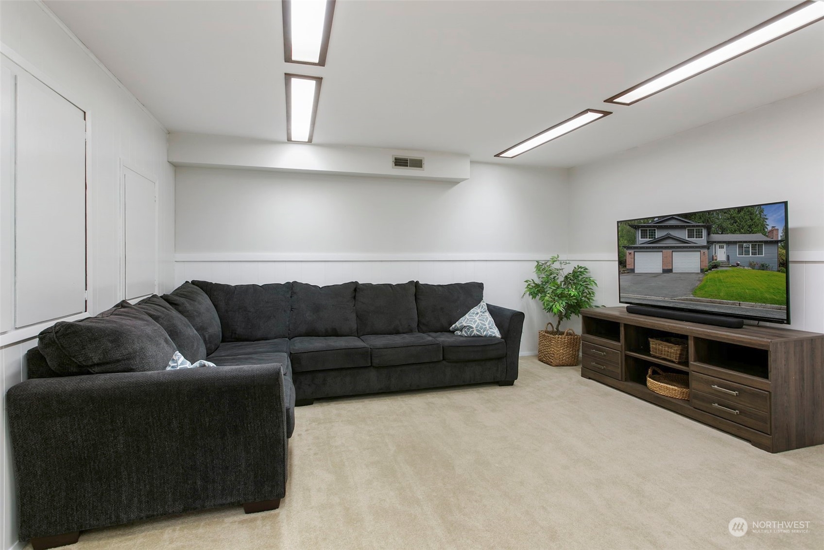 205 155th Place Southeast Bothell, WA 98012 - Photo 22 of 37 a living room with furniture and a flat screen tv