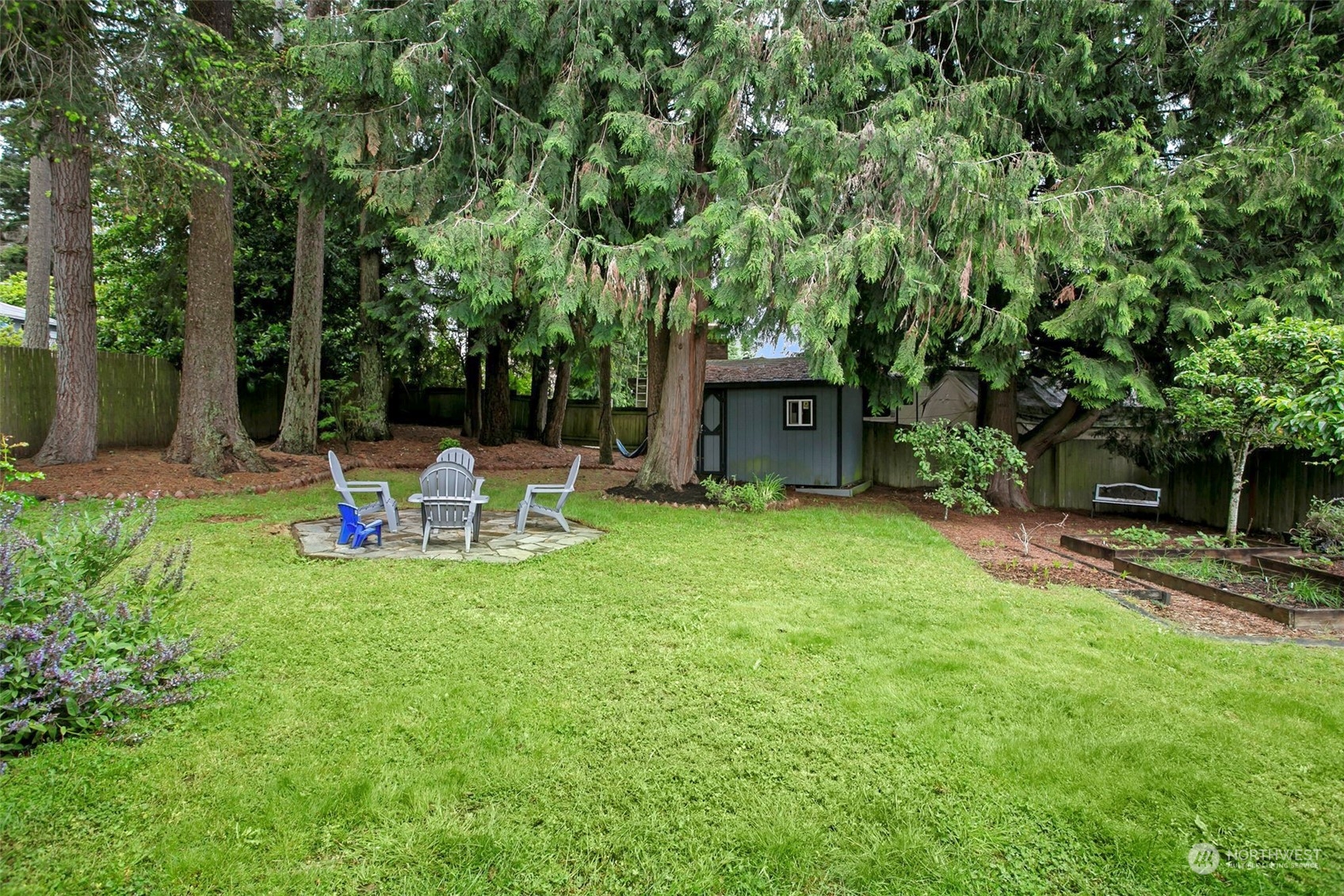 205 155th Place Southeast Bothell, WA 98012 - Photo 25 of 37 a view of a chair and table on the garden