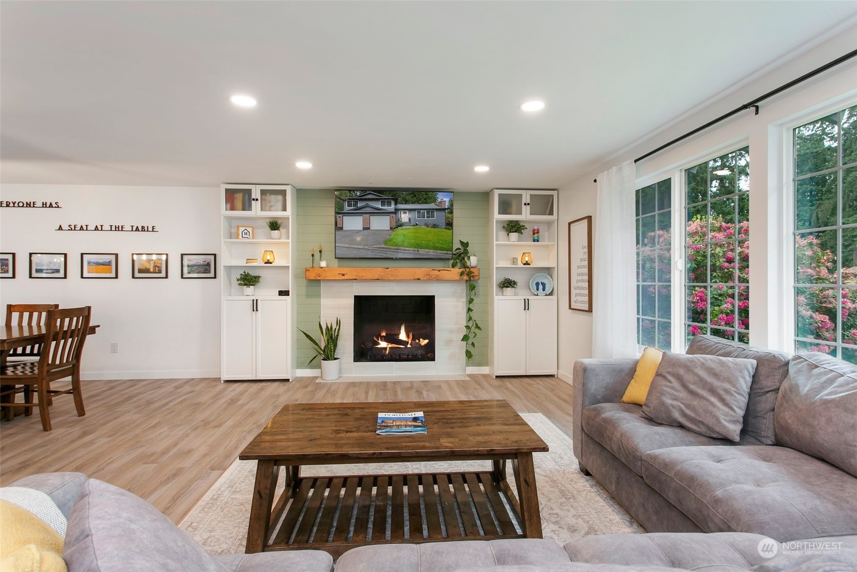 205 155th Place Southeast Bothell, WA 98012 - Photo 3 of 37 a living room with furniture and a fireplace