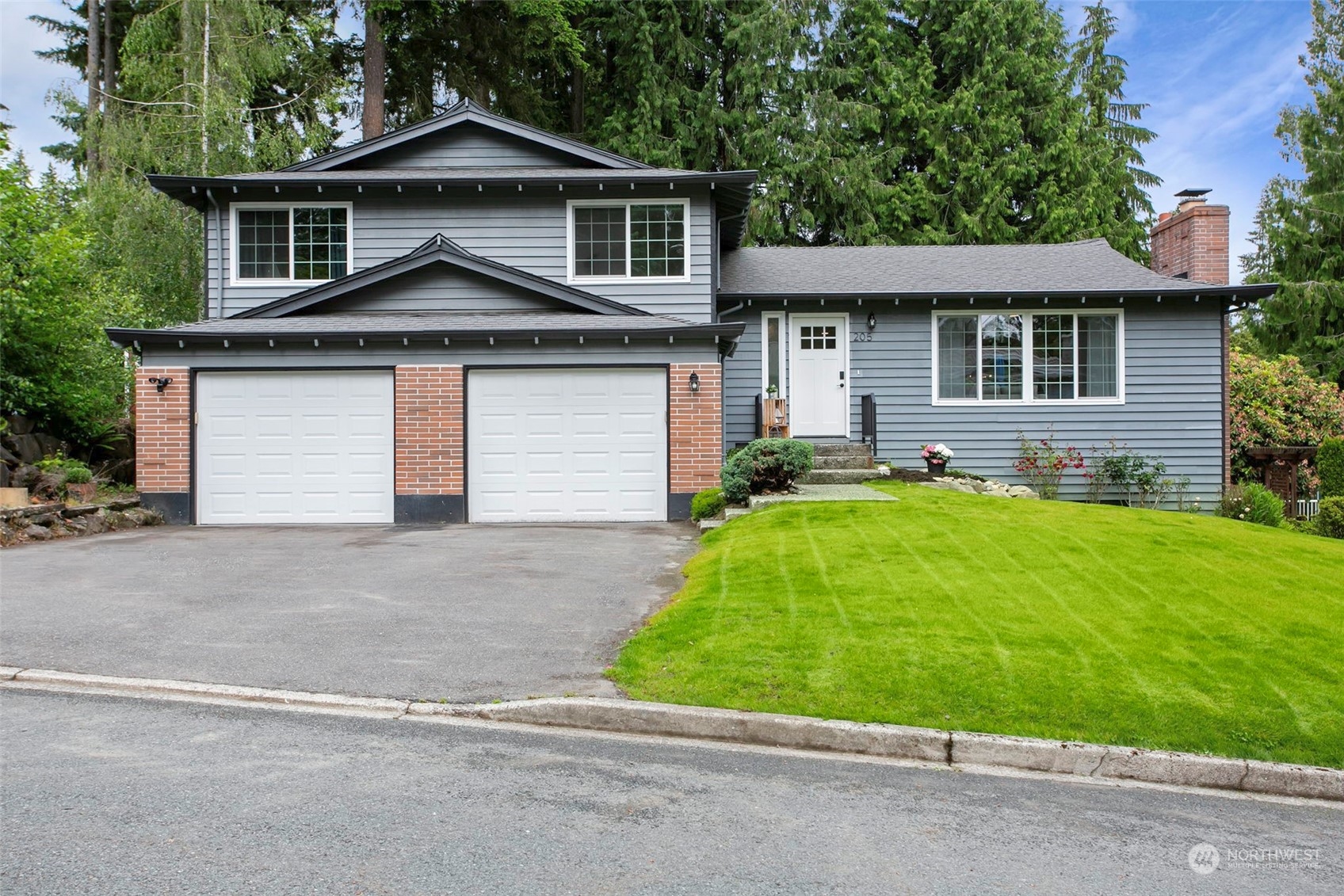 205 155th Place Southeast Bothell, WA 98012 - Photo 33 of 37 a front view of house with yard and green space