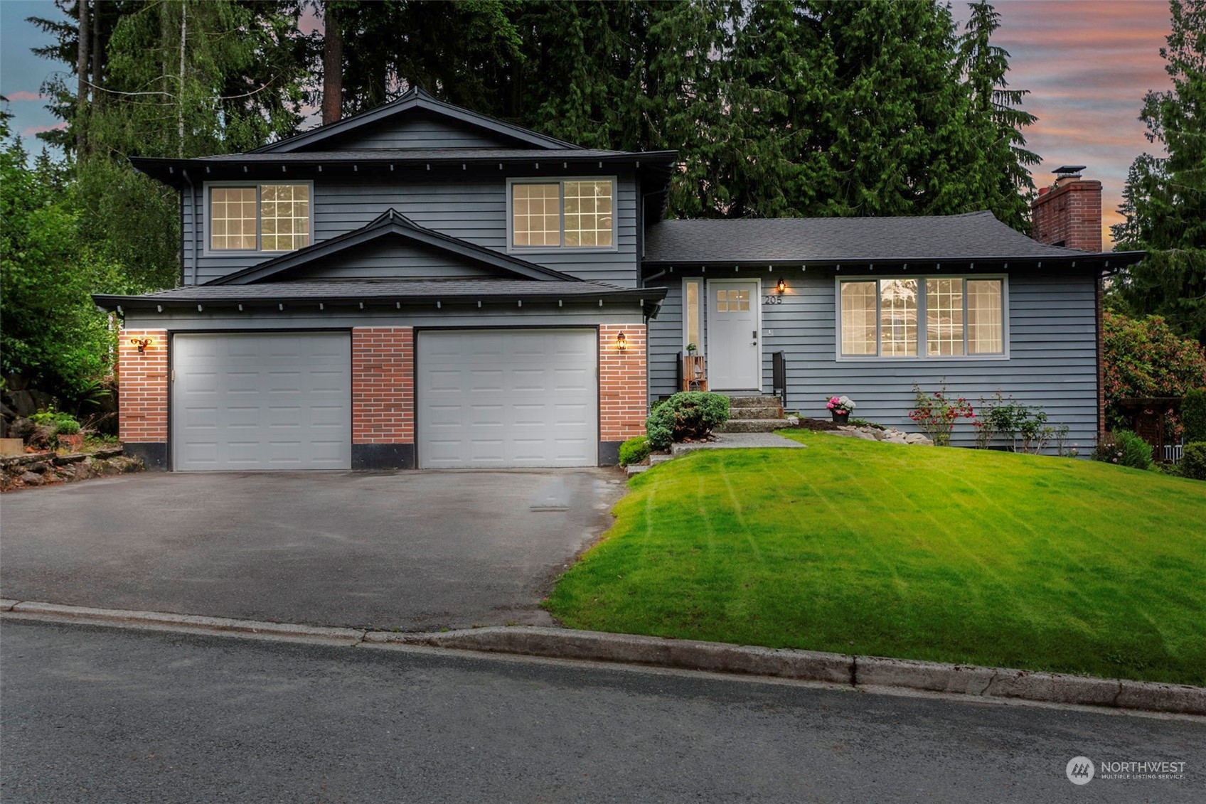 205 155th Place Southeast Bothell, WA 98012 - Photo 37 of 37 a front view of a house with a yard and garage