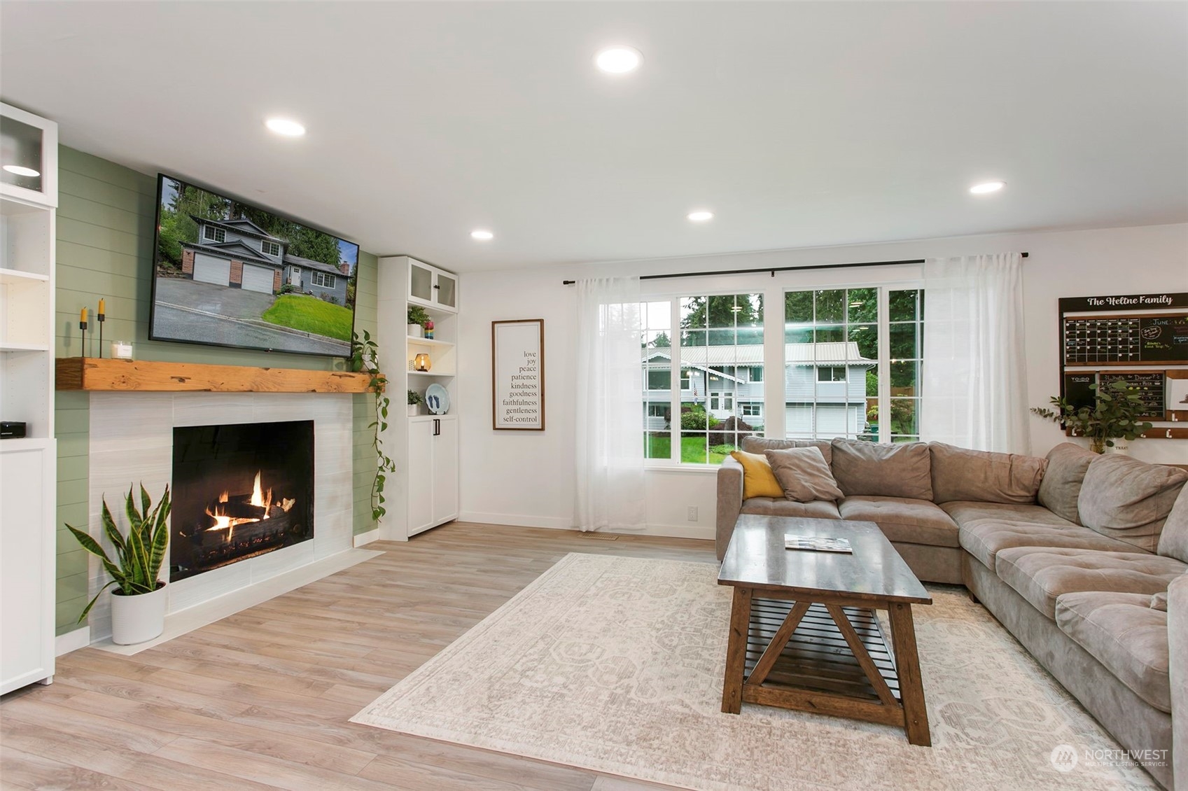 205 155th Place Southeast Bothell, WA 98012 - Photo 4 of 37 a living room with furniture and a fireplace