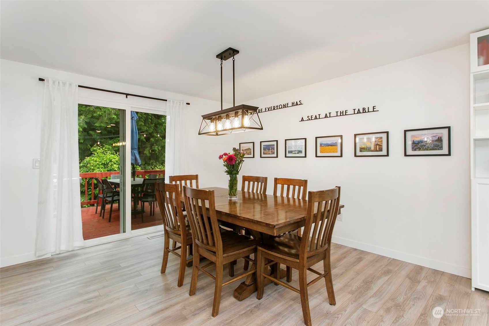205 155th Place Southeast Bothell, WA 98012 - Photo 8 of 37 a view of a dining room with furniture window and wooden floor