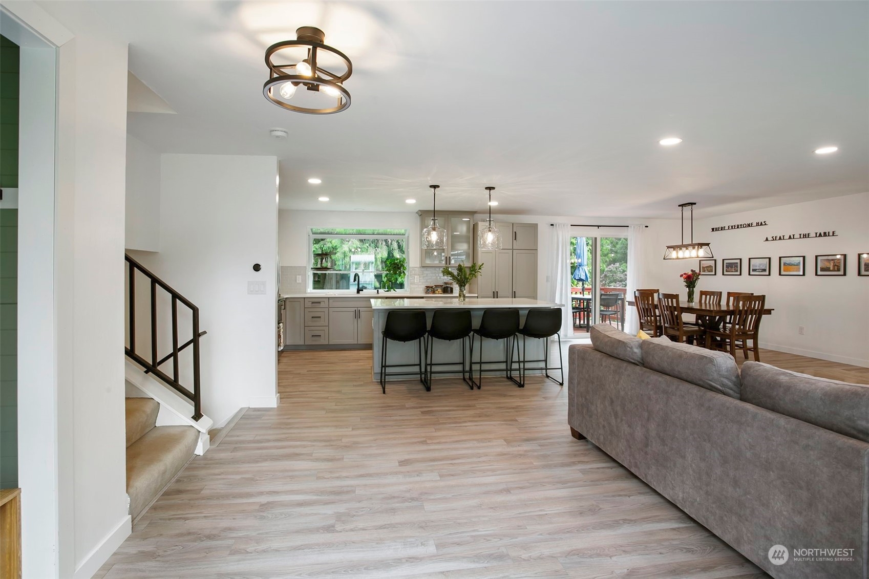 205 155th Place Southeast Bothell, WA 98012 - Photo 10 of 37 a living room with furniture kitchen view and a wooden floor