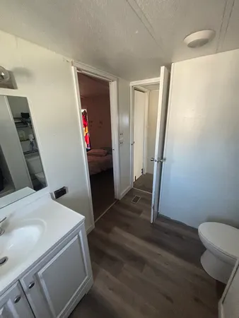a bathroom with a sink and toilet