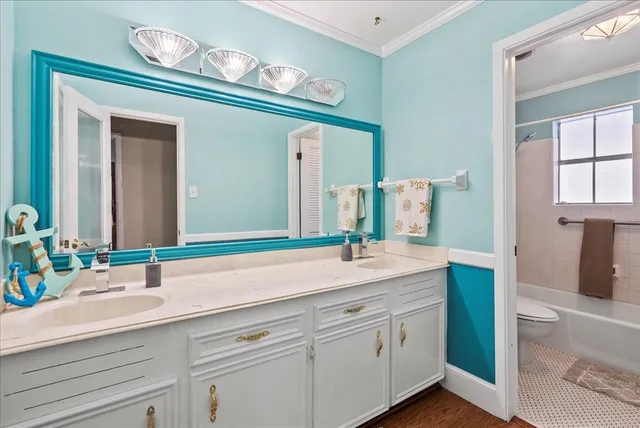 a view of a room with a ceiling fan and a window
